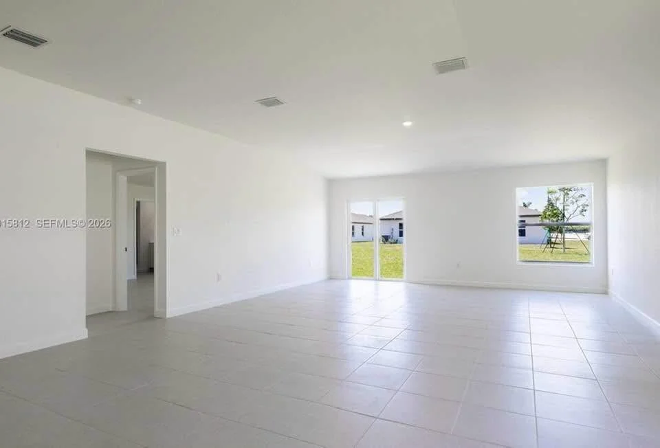 Driveway and garage view of Houston TX home available with owner financing