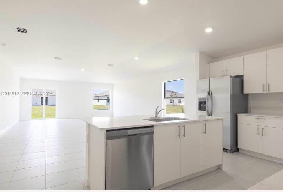 Bright modern kitchen and open living layout at 12 Main St Houston TX